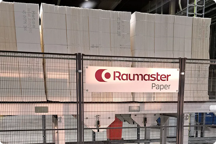 Raumaster Paper signage in front of a pulp warehouse